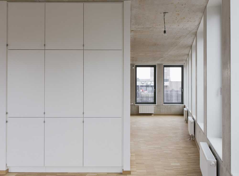 Zegel a mixed-function building with an exuberant structure toned down by the lightweight aluminum façade shell