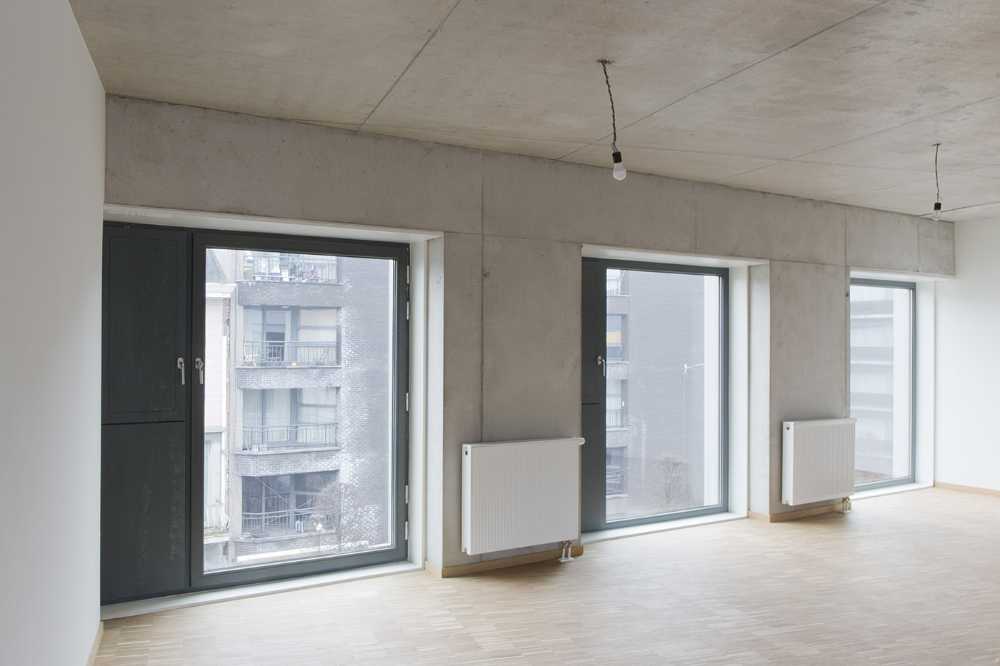 Zegel a mixed-function building with an exuberant structure toned down by the lightweight aluminum façade shell