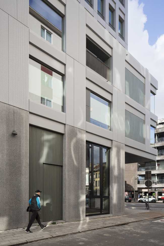 Zegel a mixed-function building with an exuberant structure toned down by the lightweight aluminum façade shell