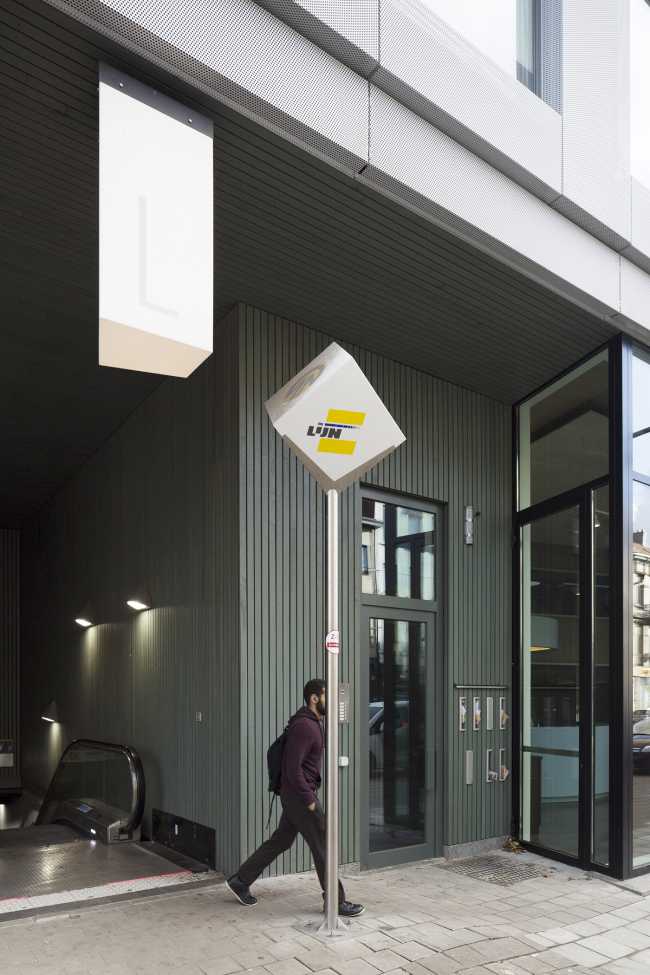 Zegel a mixed-function building with an exuberant structure toned down by the lightweight aluminum façade shell