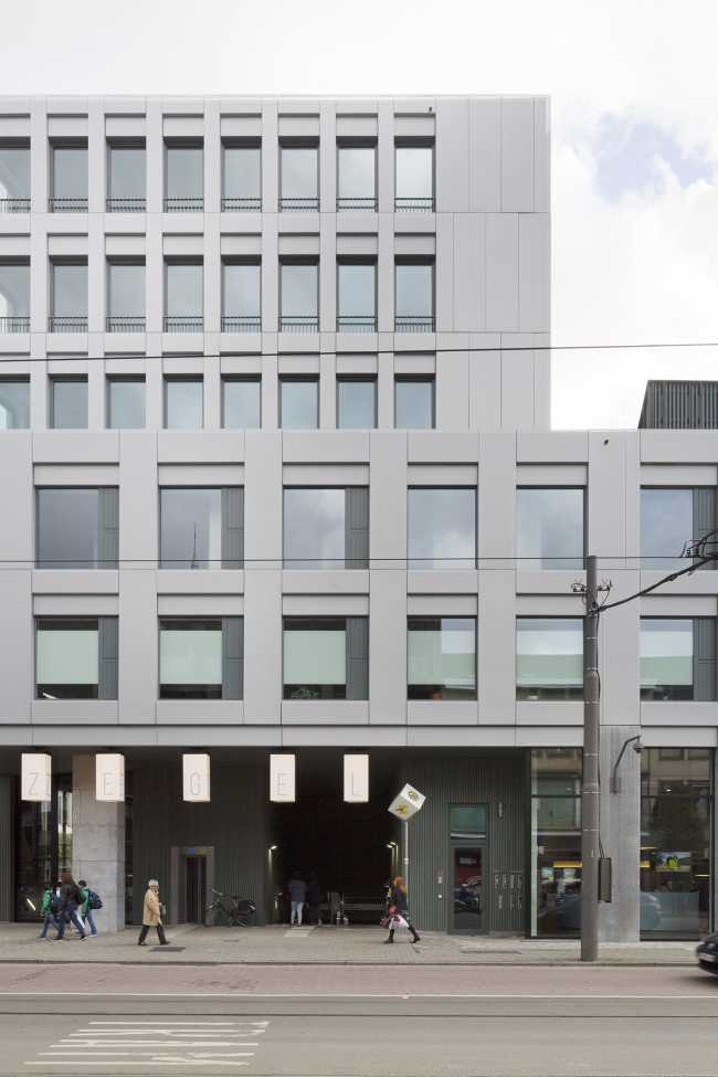 Zegel a mixed-function building with an exuberant structure toned down by the lightweight aluminum façade shell