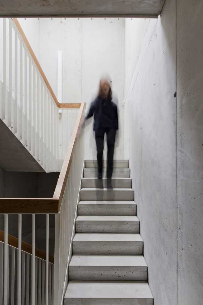 Zegel a mixed-function building with an exuberant structure toned down by the lightweight aluminum façade shell