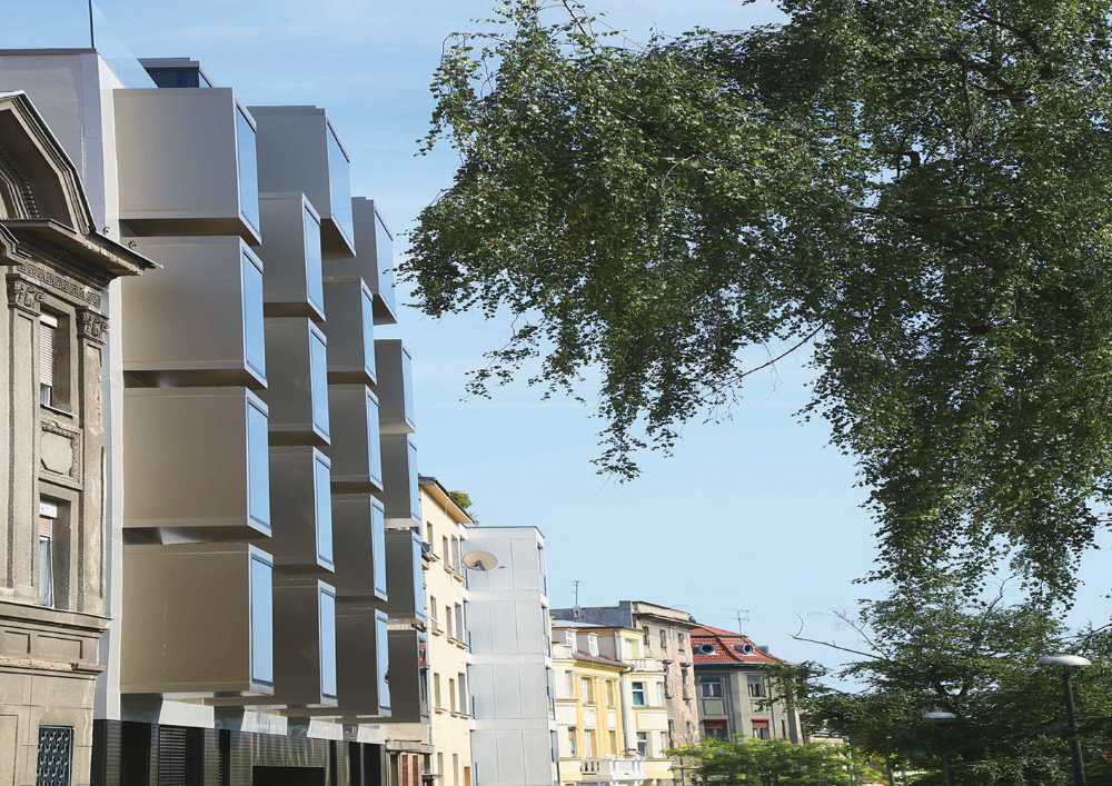 Tridimensionalidad y juego de volúmenes en la fachada. Edificio residencial Interpolation B