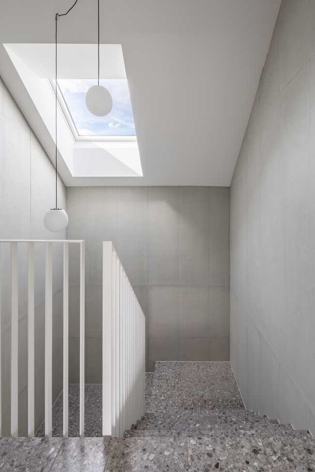 House for two families in Lucerne. A rigorous floating structure attenuated by playful openings