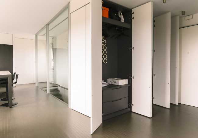 The penthouse unit with the city inside. An extroverted penthouse in a historic building in Bologna