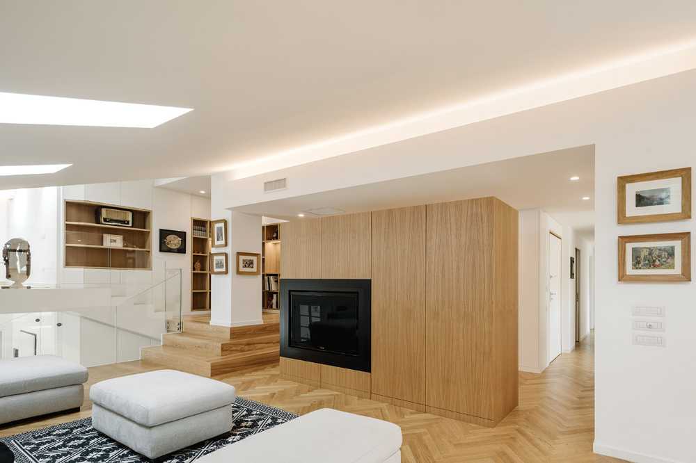 Fusione di tre mansarde per la realizzazione di Casa AA: uno spazio trasmutato, ampio moderno ed elegante
