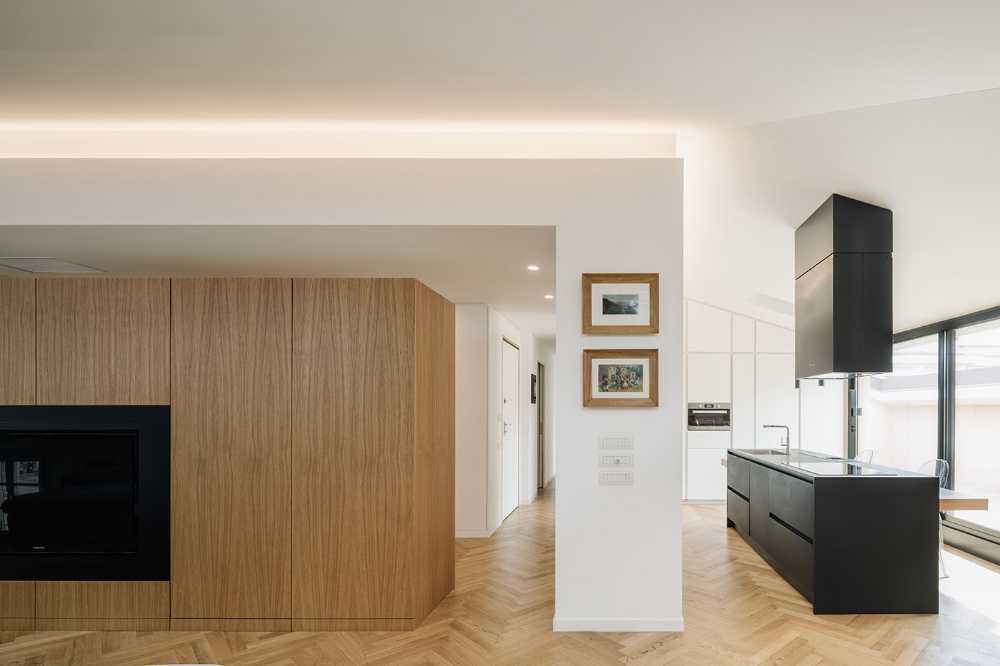 Fusione di tre mansarde per la realizzazione di Casa AA: uno spazio trasmutato, ampio moderno ed elegante