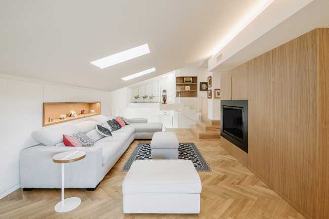 Fusion of three attics for the realization of Casa AA: a transmuted space, wide, modern and elegant