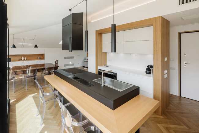 Fusion of three attics for the realization of Casa AA: a transmuted space, wide, modern and elegant