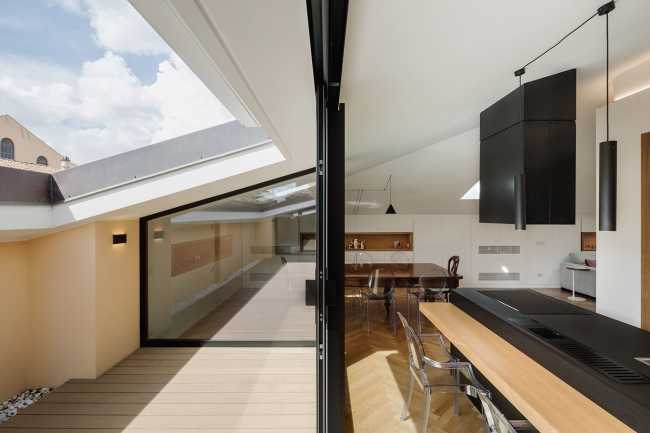 Fusion of three attics for the realization of Casa AA: a transmuted space, wide, modern and elegant