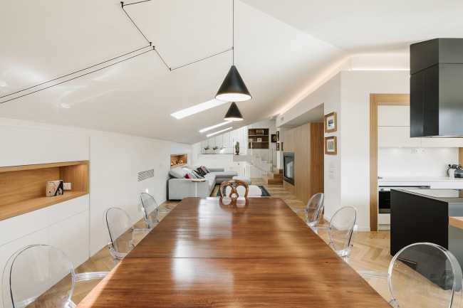 Fusion of three attics for the realization of Casa AA: a transmuted space, wide, modern and elegant