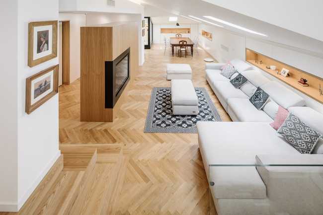 Fusion of three attics for the realization of Casa AA: a transmuted space, wide, modern and elegant