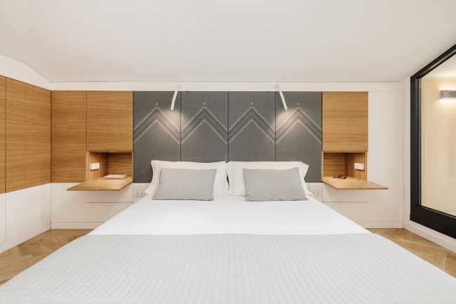 Fusion of three attics for the realization of Casa AA: a transmuted space, wide, modern and elegant