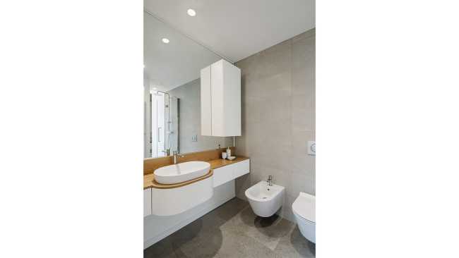 Fusion of three attics for the realization of Casa AA: a transmuted space, wide, modern and elegant