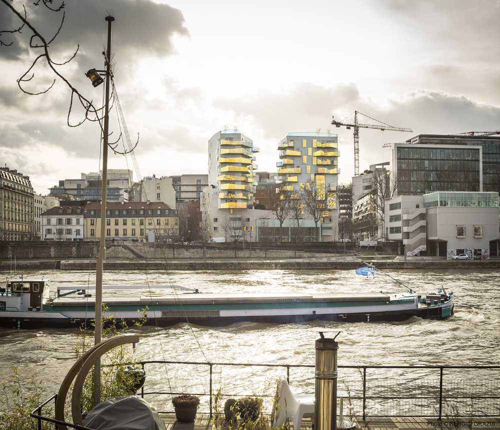 Fulton Project in Paris. Social housing units, shops, and the landscaped heart of the island