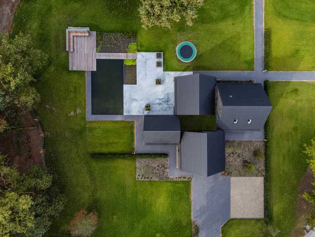 Nestled in the lap of an ancient medieval agricultural area, the former site of an automobile company transforms into a