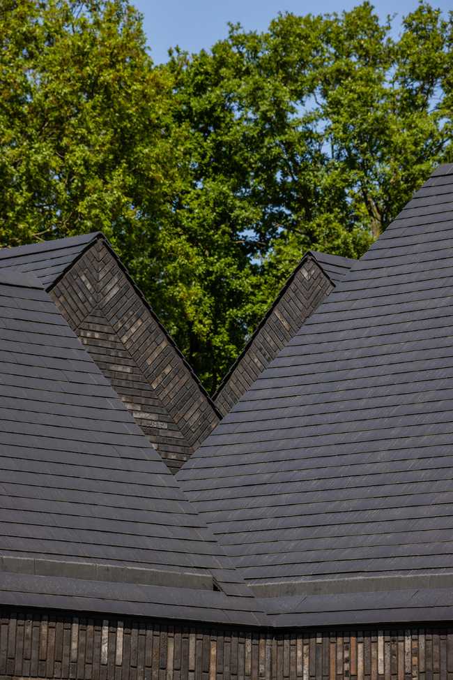 Nestled in the lap of an ancient medieval agricultural area, the former site of an automobile company transforms into a