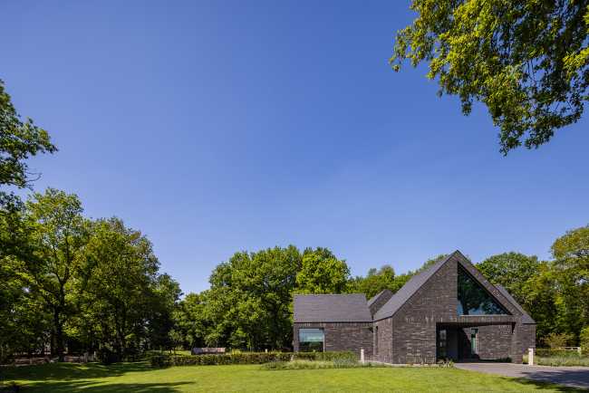 Nestled in the lap of an ancient medieval agricultural area, the former site of an automobile company transforms into a