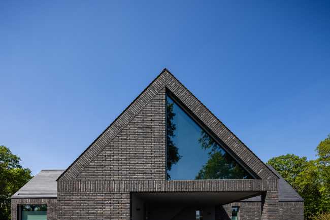 Nestled in the lap of an ancient medieval agricultural area, the former site of an automobile company transforms into a