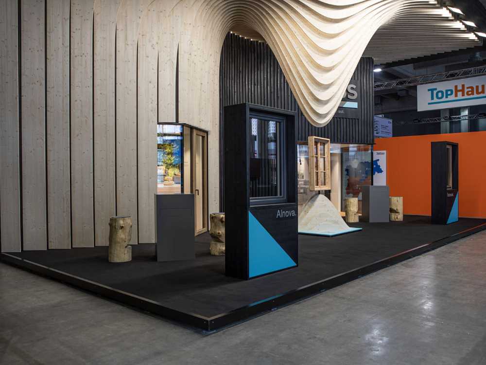 Exhibit design project Suspended Folds. A trade show booth conceived reflecting on the malleability of wood