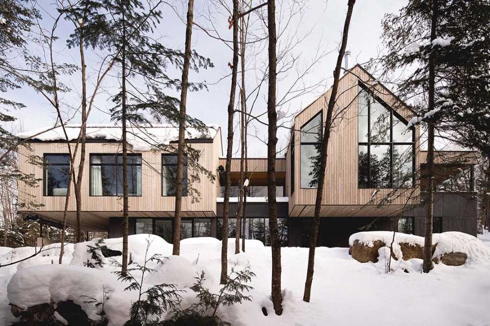 Varied volumetrics and local materials of the La Tierce residence for a living experience intimately linked with nature