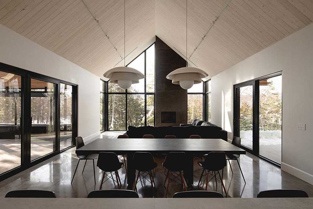 Varied volumetrics and local materials of the La Tierce residence for a living experience intimately linked with nature