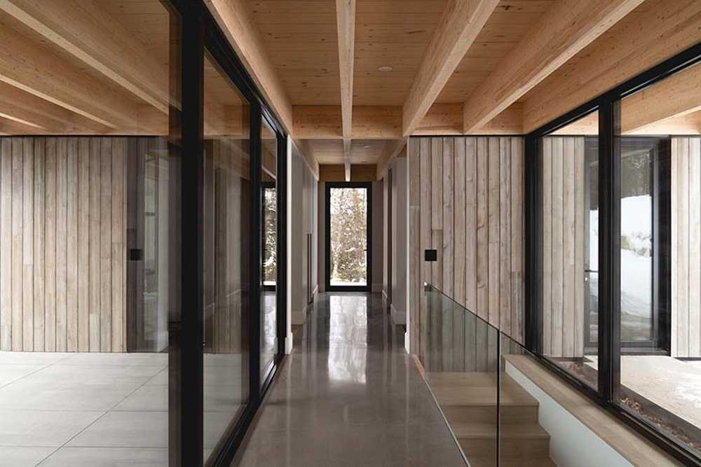 Varied volumetrics and local materials of the La Tierce residence for a living experience intimately linked with nature