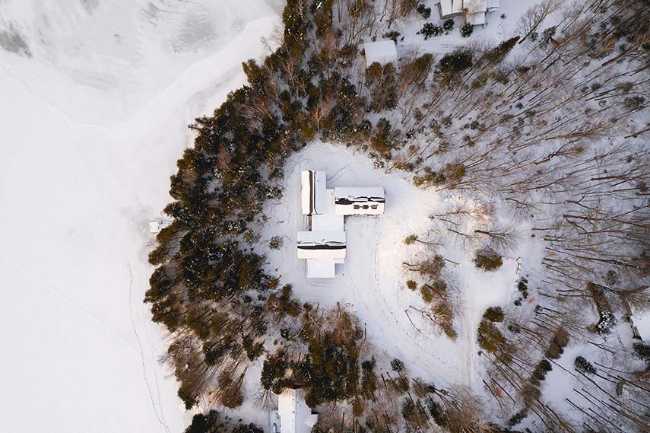 Varied volumetrics and local materials of the La Tierce residence for a living experience intimately linked with nature