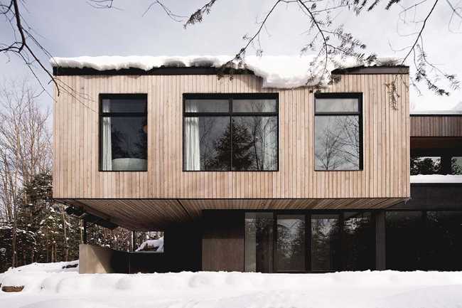 Varied volumetrics and local materials of the La Tierce residence for a living experience intimately linked with nature