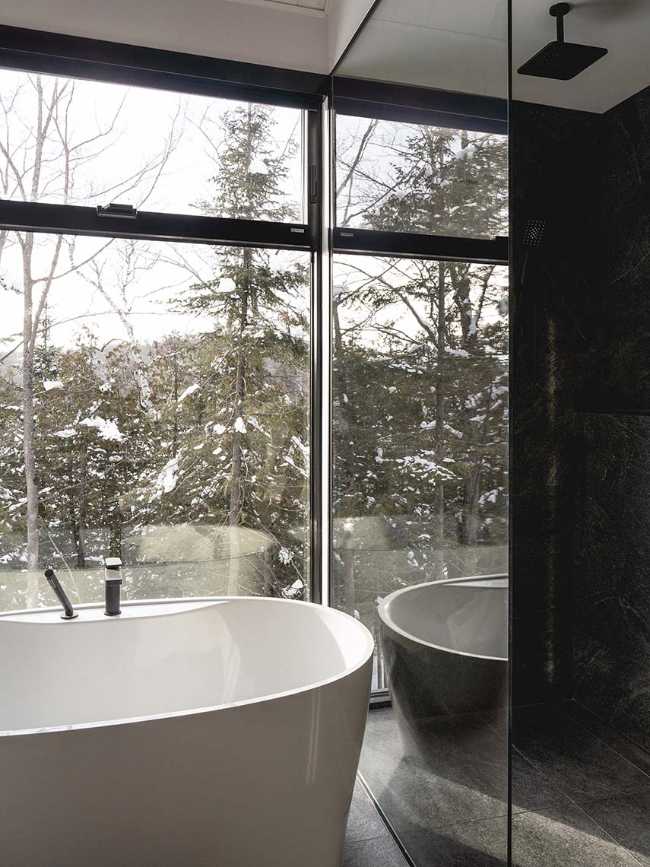 Varied volumetrics and local materials of the La Tierce residence for a living experience intimately linked with nature