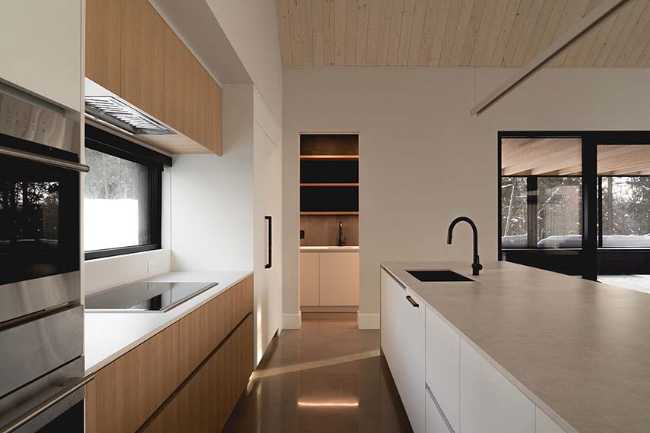 Varied volumetrics and local materials of the La Tierce residence for a living experience intimately linked with nature