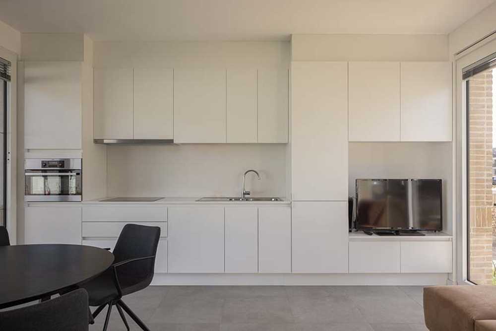 Ten Boomgaard. Seven new starter homes around a collective garden