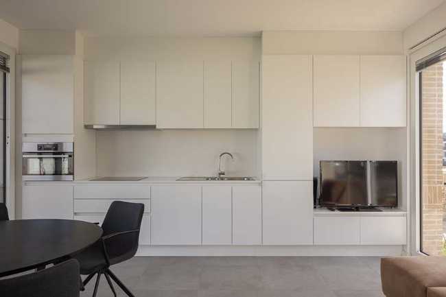 Ten Boomgaard. Seven new starter homes around a collective garden