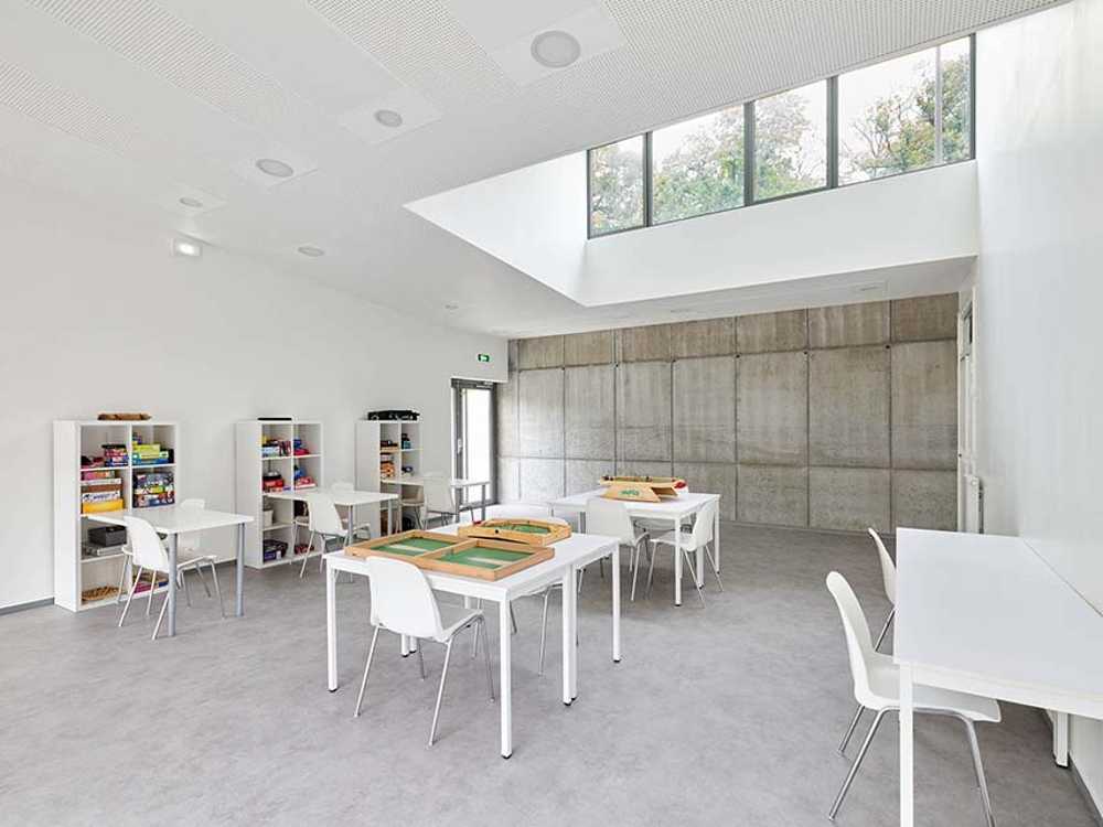 The Morel de Vindé Recreational Center welcomes you in a wooden embrace