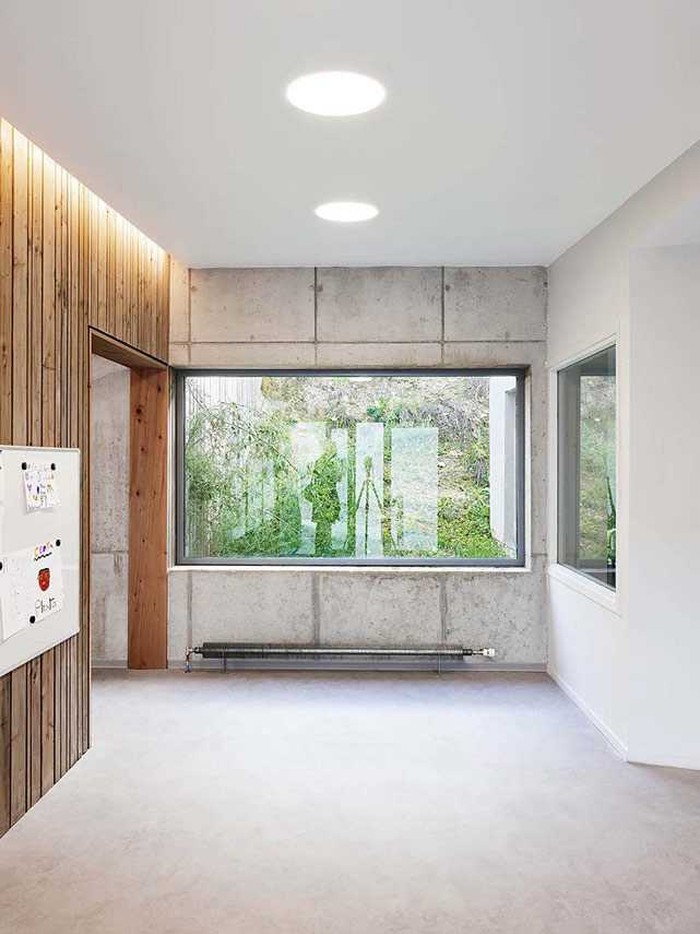 The Morel de Vindé Recreational Center welcomes you in a wooden embrace