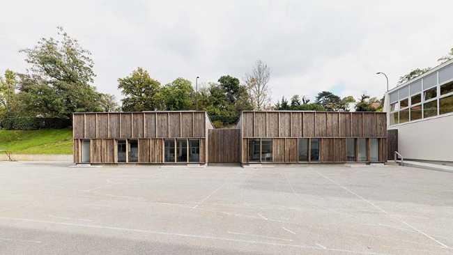 The Morel de Vindé Recreational Center welcomes you in a wooden embrace