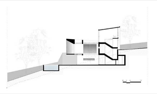 Un prisme en béton capture le panorama. Villa PNOES à Penteli