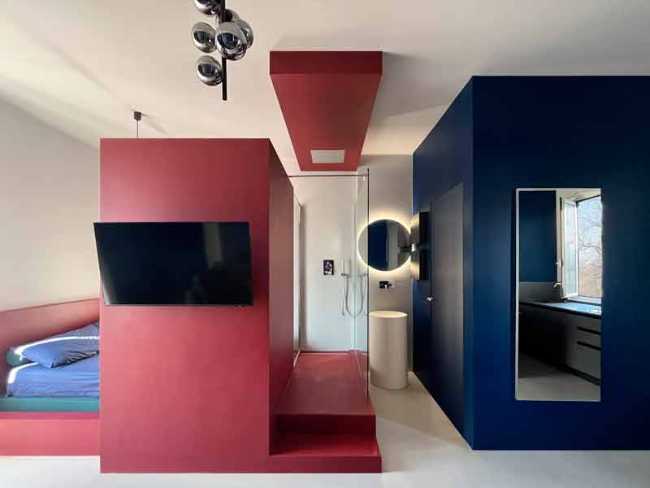 Cooper House, Milanese pied-à-terre is tinged with red and blue.