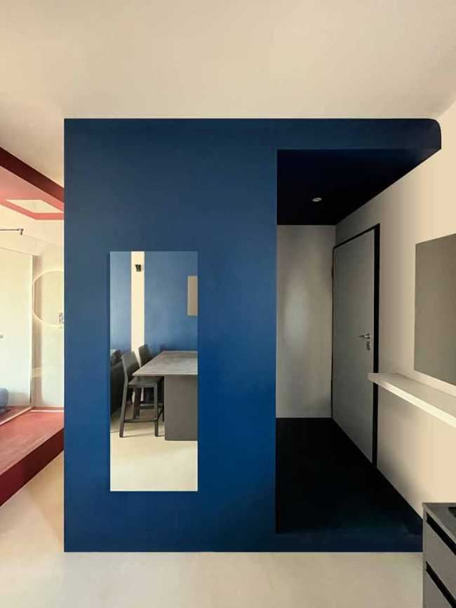 Cooper House, Milanese pied-à-terre is tinged with red and blue.