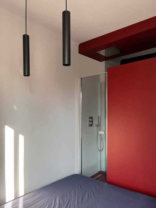 Cooper House, Milanese pied-à-terre is tinged with red and blue.