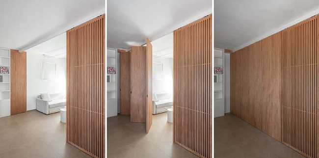 Maison à Gualdo. Mobilier flexible pour moduler l'intimité et la lumière