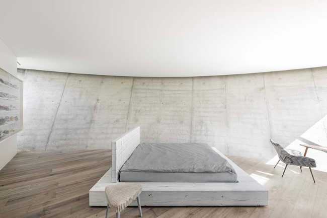 Villa O: una scultura circolare tra lago e natura