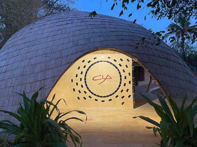 Architecture studio on water's edge. Organic temple of creativity