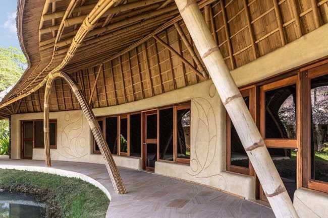 Architecture studio on water's edge. Organic temple of creativity