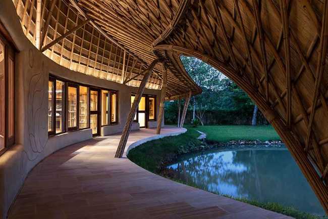 Architecture studio on water's edge. Organic temple of creativity