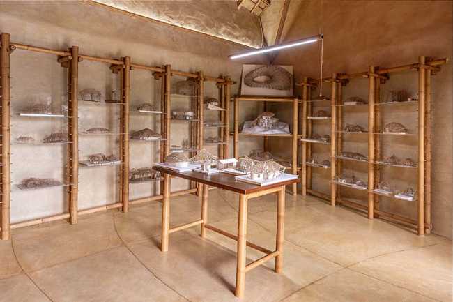 Architecture studio on water's edge. Organic temple of creativity