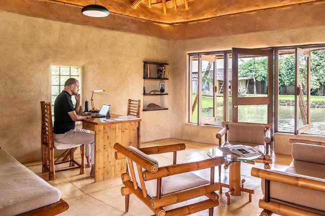 Architecture studio on water's edge. Organic temple of creativity