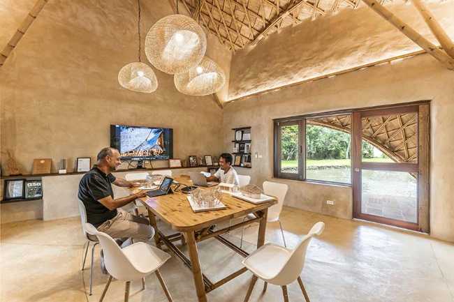 Architecture studio on water's edge. Organic temple of creativity