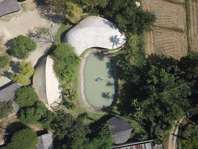 Architecture studio on water's edge. Organic temple of creativity