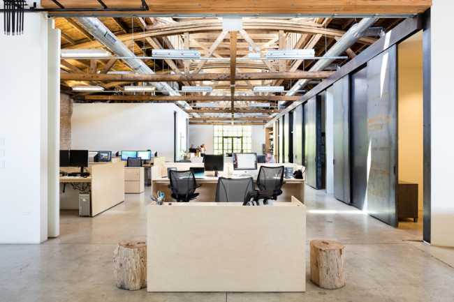 interior open space office with wooden desks
